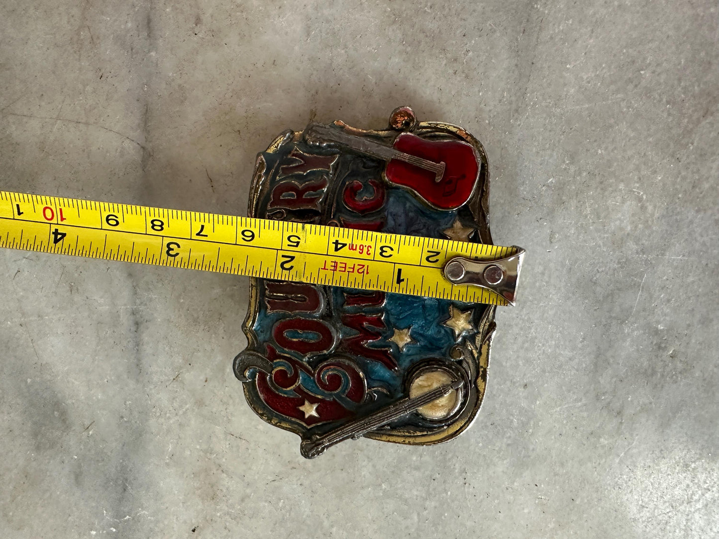 1982 Enameled Country Music Buckle ~ Serial Number H919 ~ The Great American Buckle Co U.S.A. Copyright 1982 Made in the U.S.A.