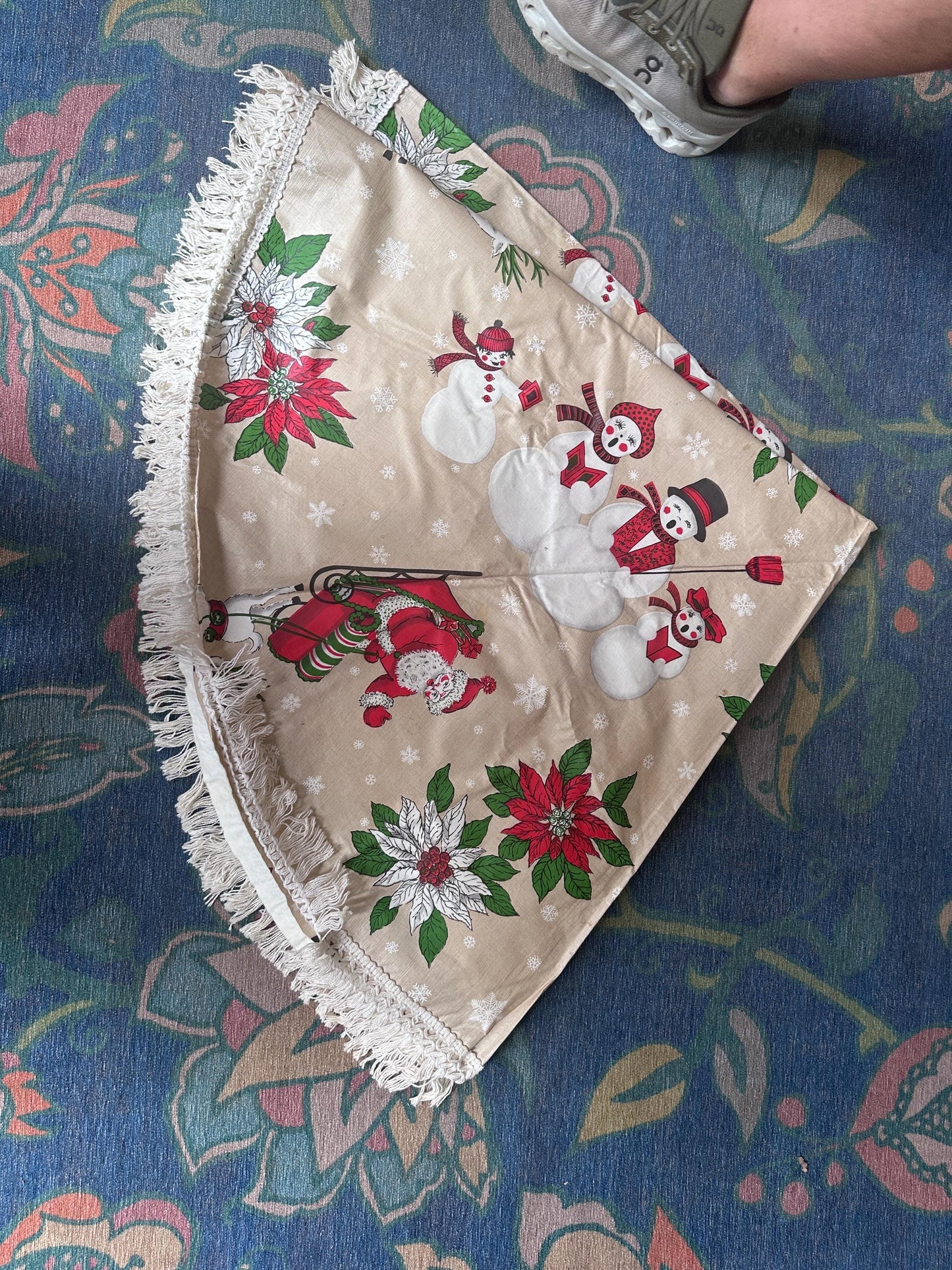 Vintage Kitschy Christmas Round Vinyl Tablecloth | Santa, Snowy Winter & Poinsettia Holiday Print | 60” with White Trim | Retro Holiday Deco