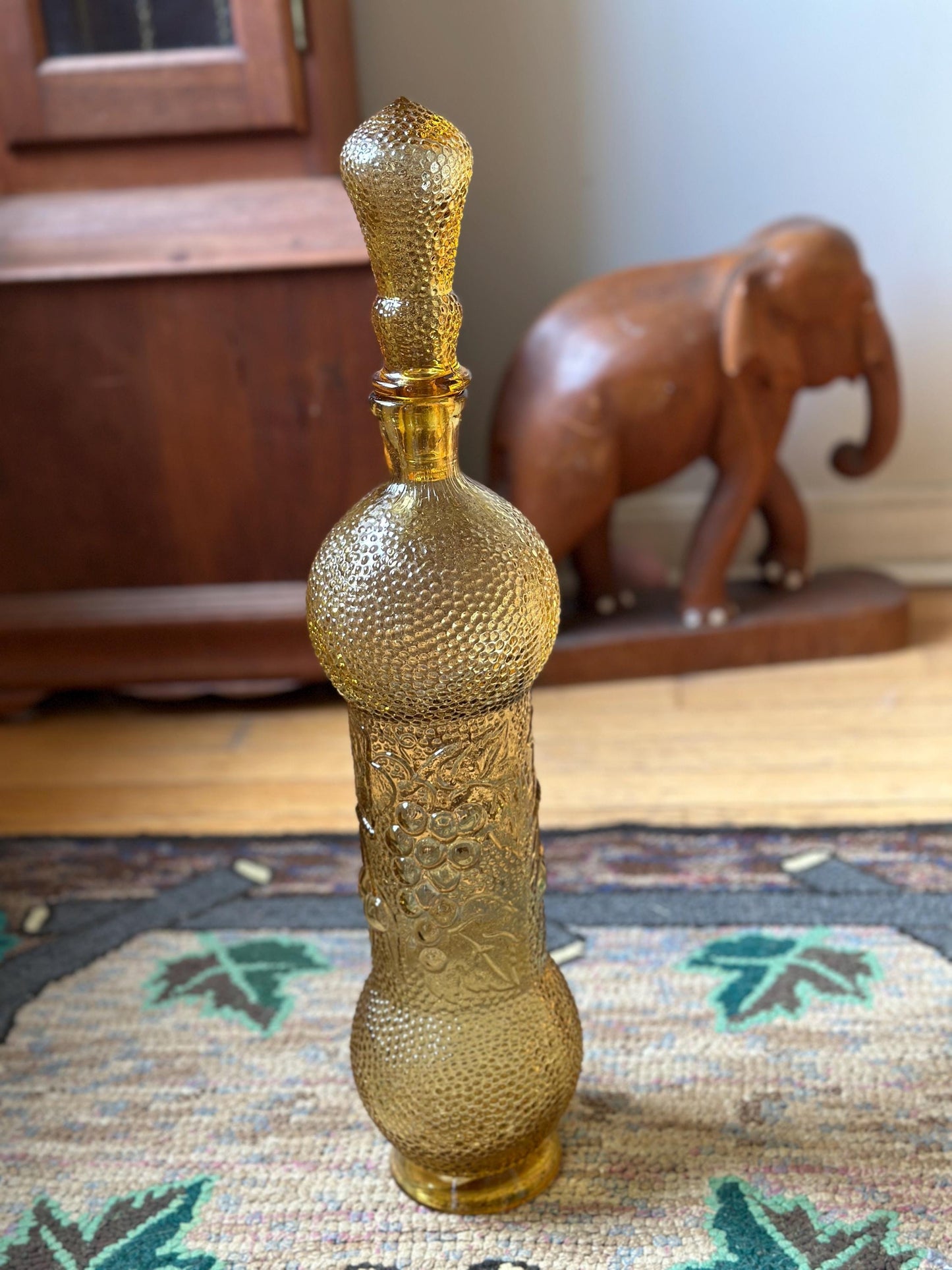 Vintage Empoli Honey Amber Decanter: Hobnail Glass with Embossed Grapes