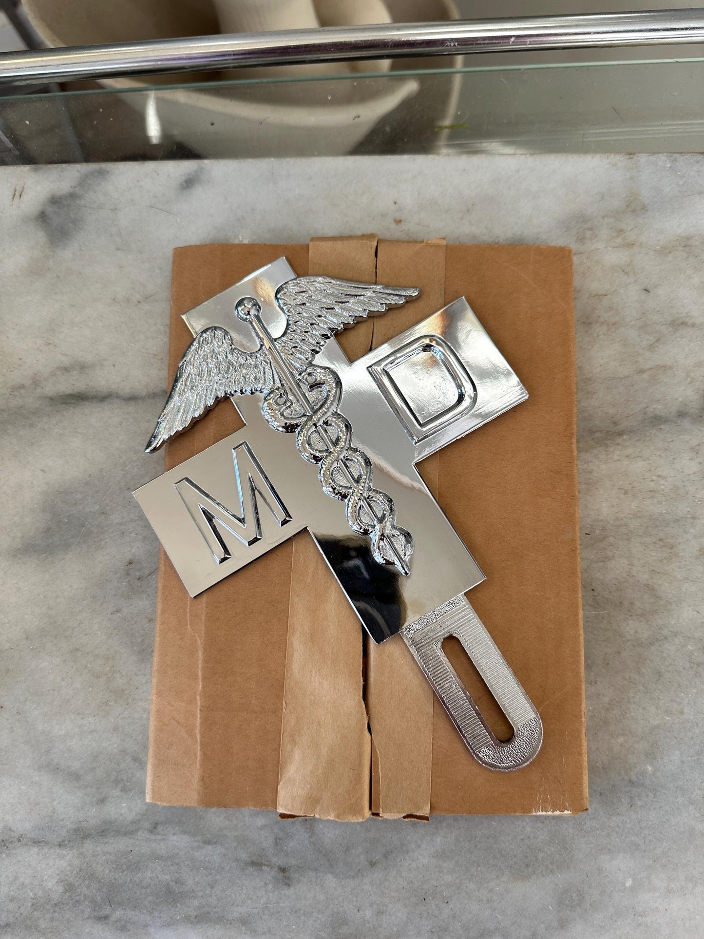 1960s Chrome MD Doctor License Plate Badge – New Old Stock Car Emblem