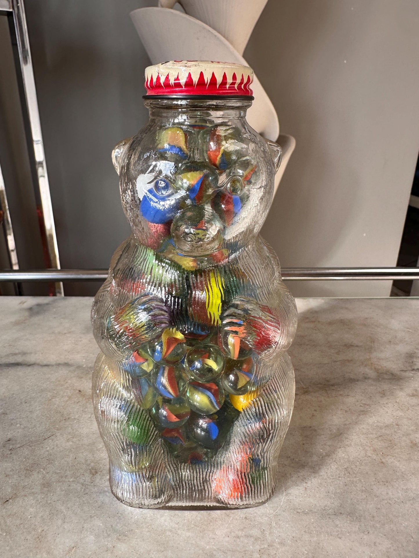 Vintage Snow Crest Glass Bear Bottle Bank with Marbles: Cat Eye Shooters
