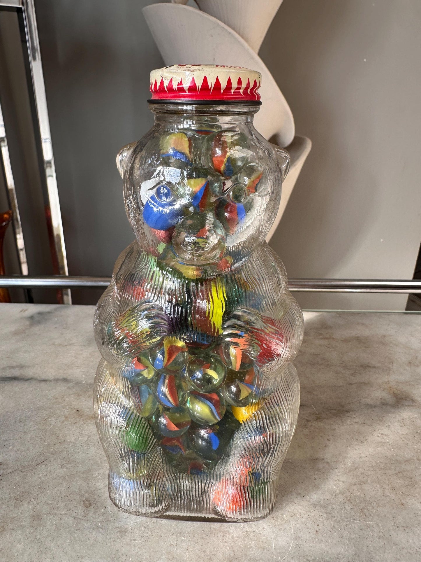 Vintage Snow Crest Glass Bear Bottle Bank with Marbles: Cat Eye Shooters
