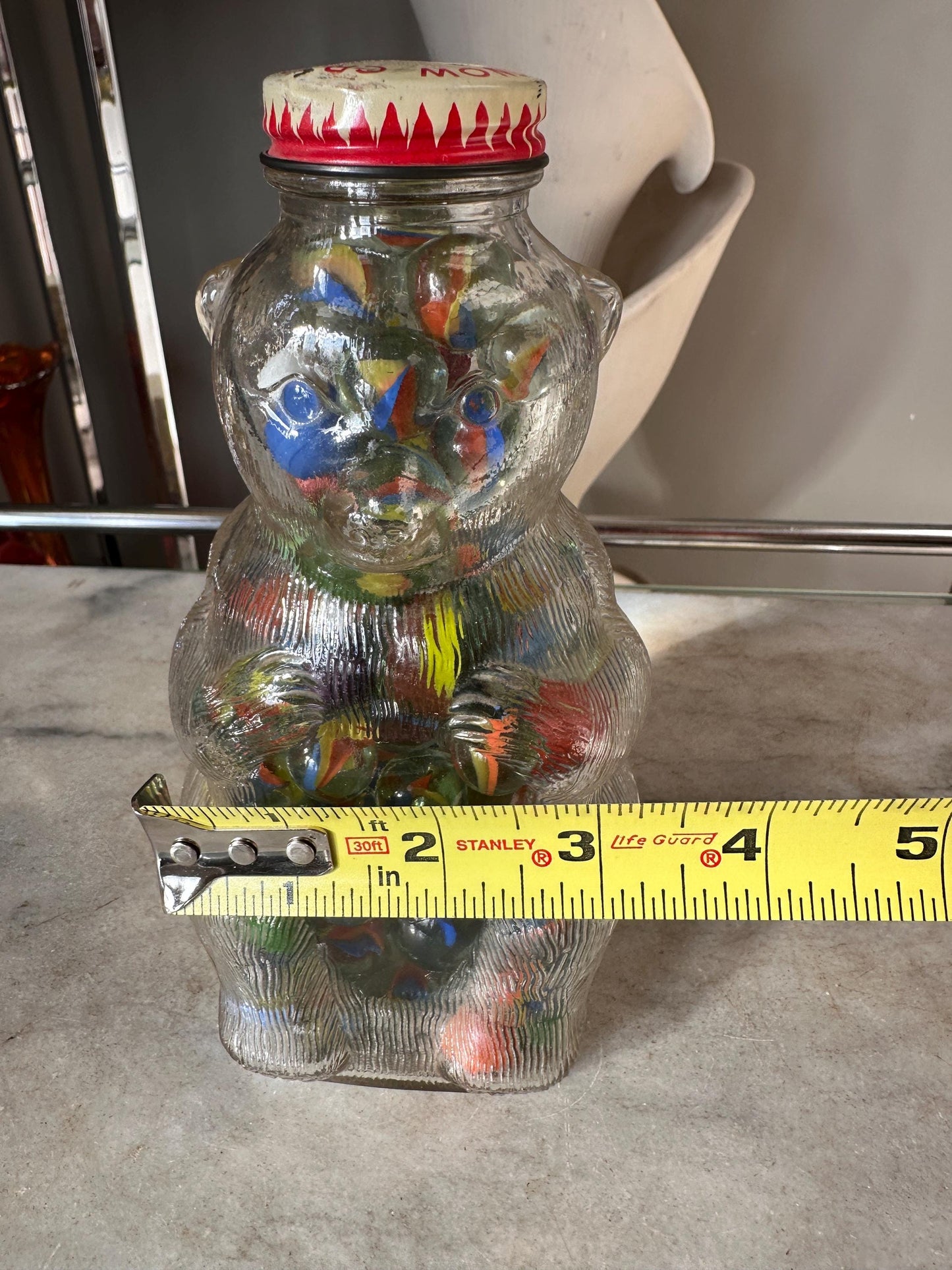 Vintage Snow Crest Glass Bear Bottle Bank with Marbles: Cat Eye Shooters