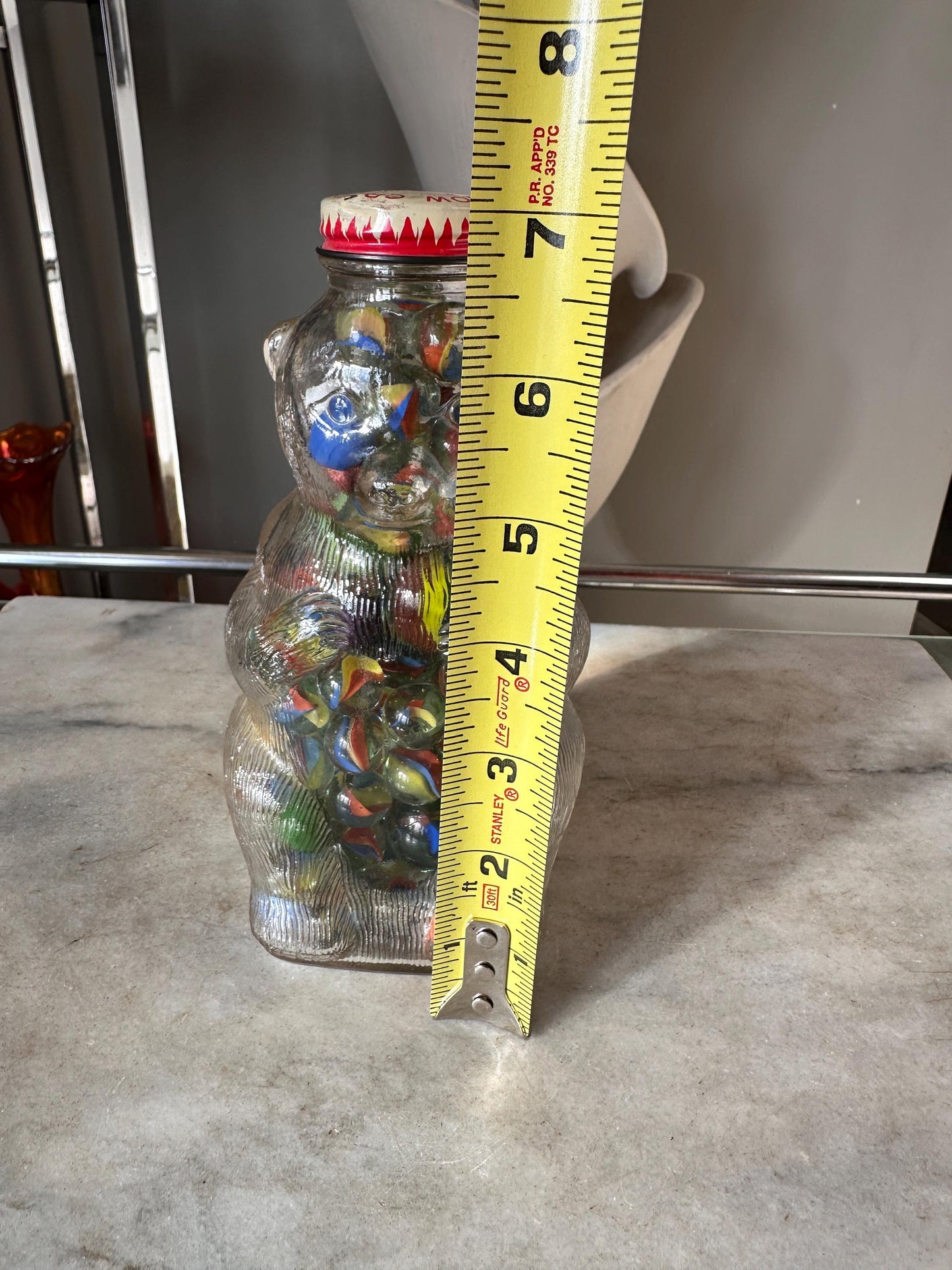 Vintage Snow Crest Glass Bear Bottle Bank with Marbles: Cat Eye Shooters