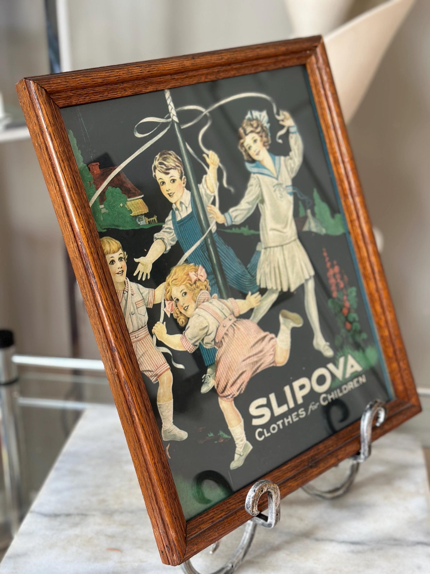 Framed Slipova Children's Clothing Ad Print – Vintage Nursery Wall Art 16” x 13”