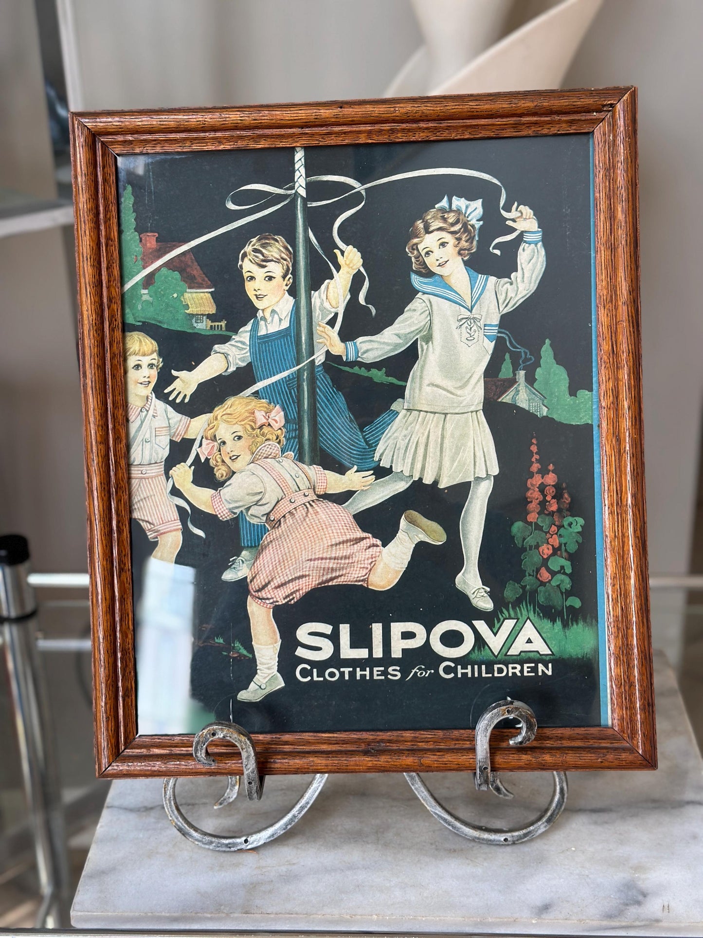 Framed Slipova Children's Clothing Ad Print – Vintage Nursery Wall Art 16” x 13”