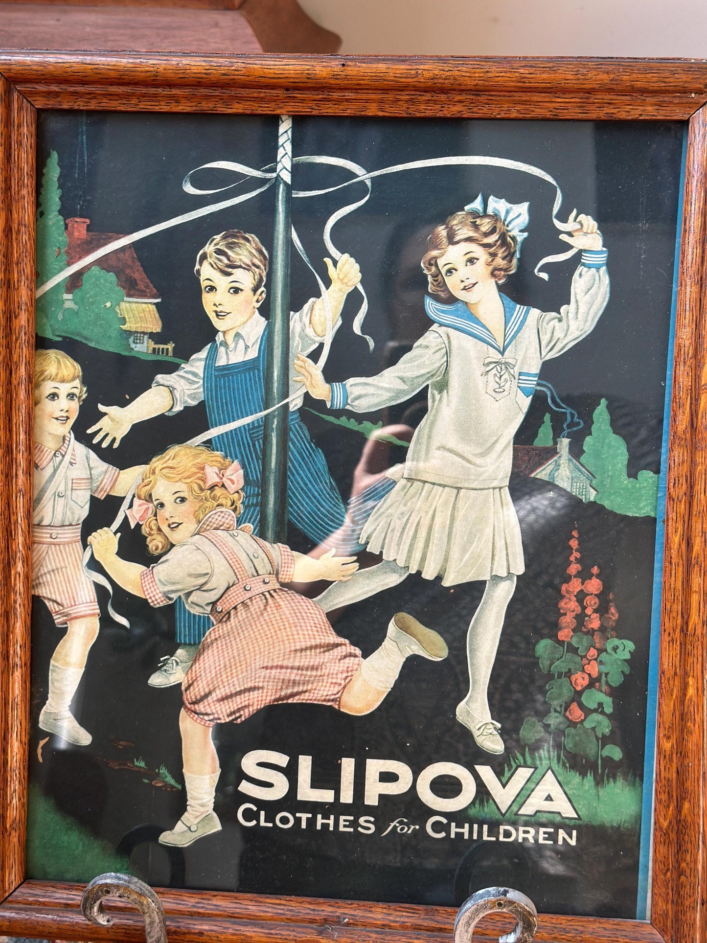 Framed Slipova Children's Clothing Ad Print – Vintage Nursery Wall Art 16” x 13”