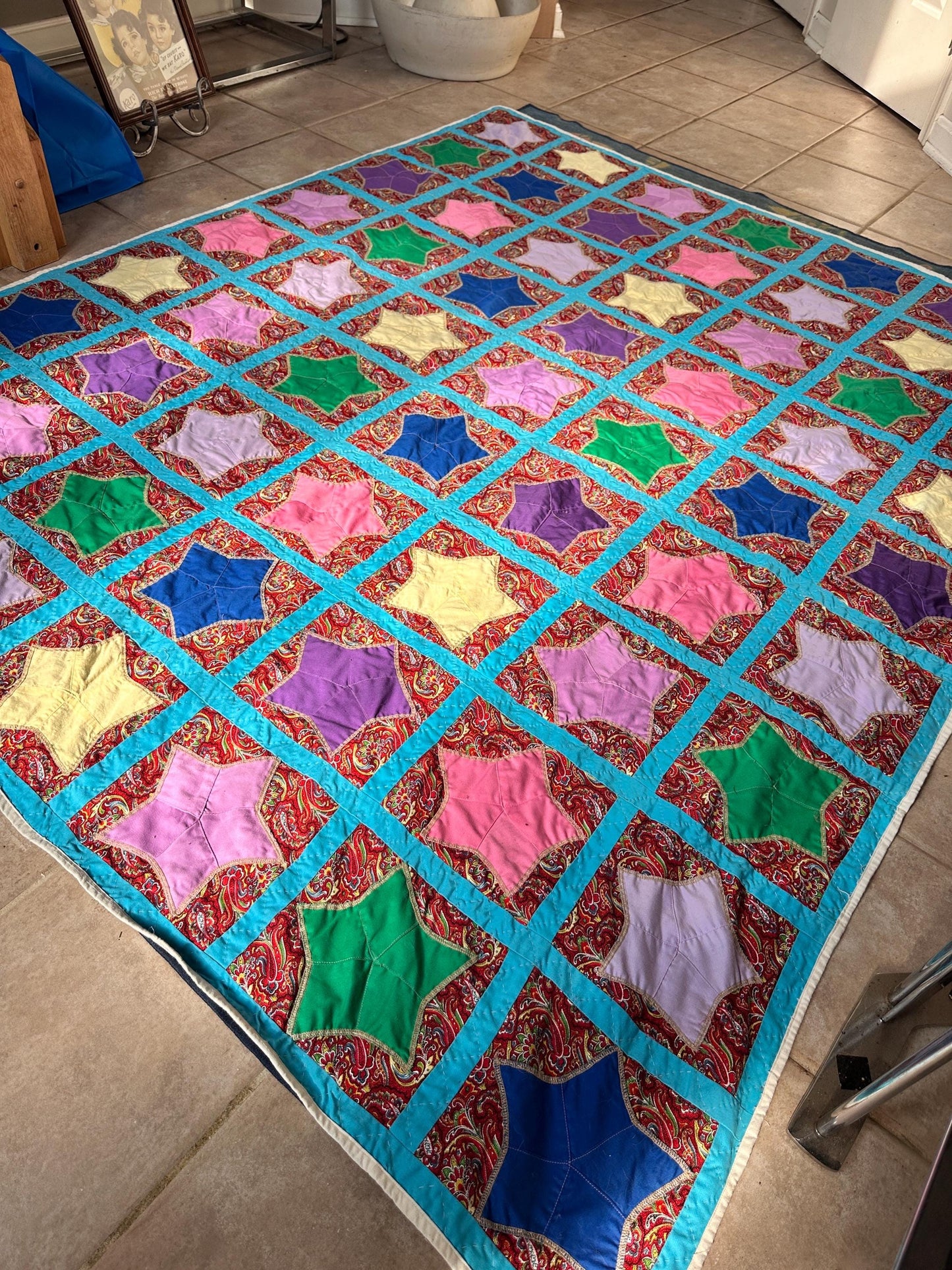 1980s Hand-Stitched Star Quilt – Multicolor Cotton, Paisley Background, Turquoise Border (67" x 77")