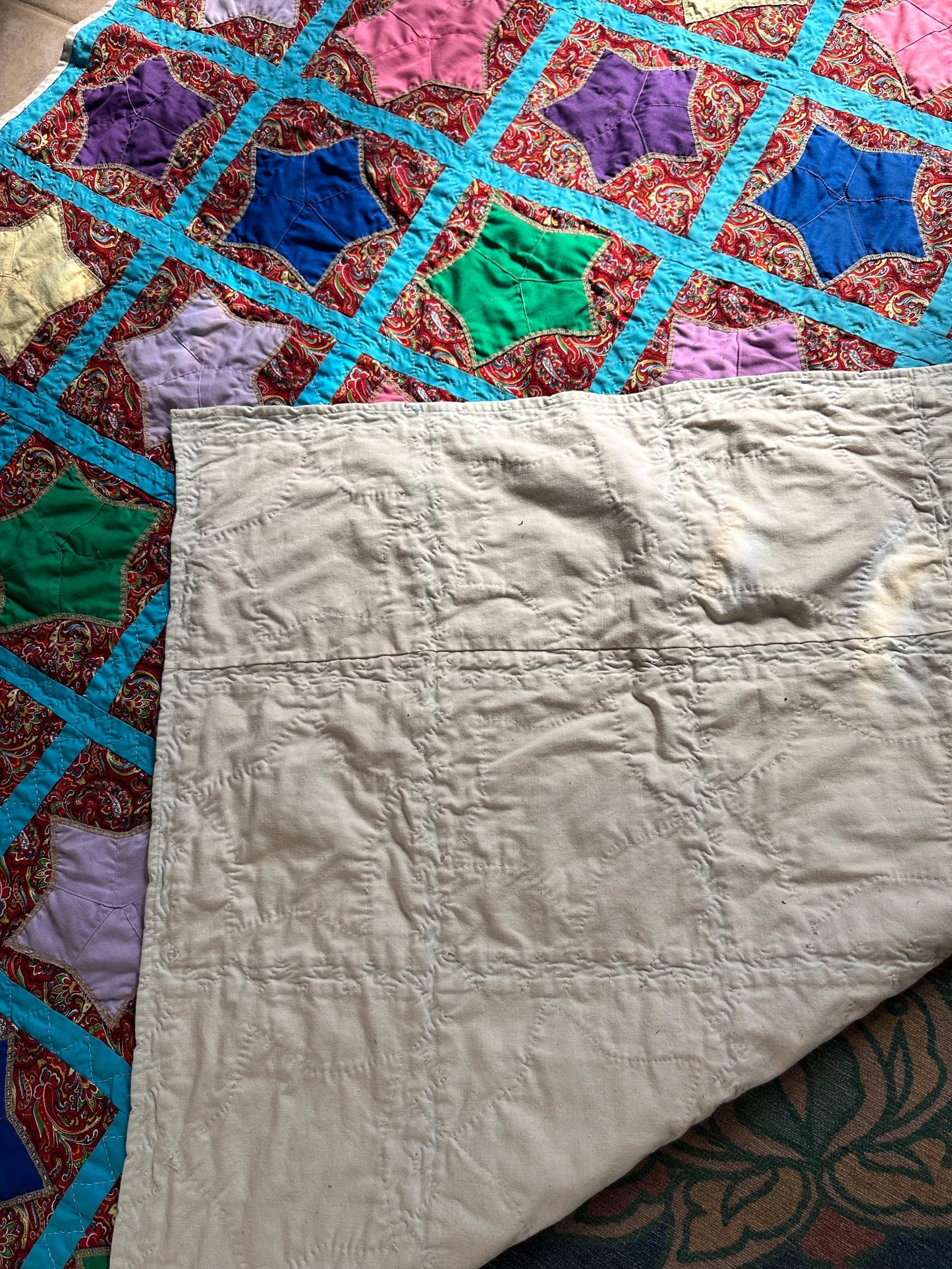 1980s Hand-Stitched Star Quilt – Multicolor Cotton, Paisley Background, Turquoise Border (67" x 77")