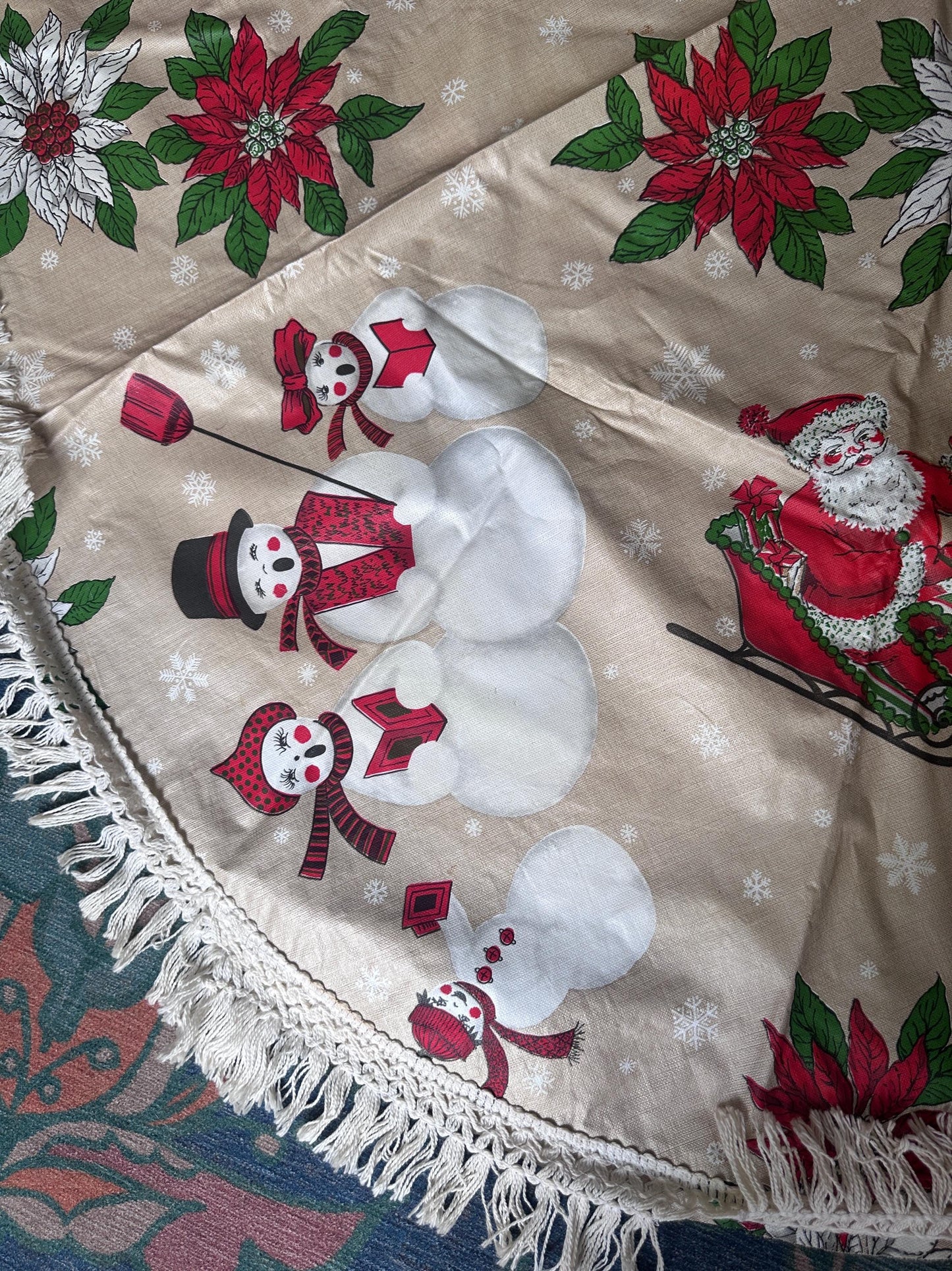 Vintage Kitschy Christmas Round Vinyl Tablecloth | Santa, Snowy Winter & Poinsettia Holiday Print | 60” with White Trim | Retro Holiday Deco