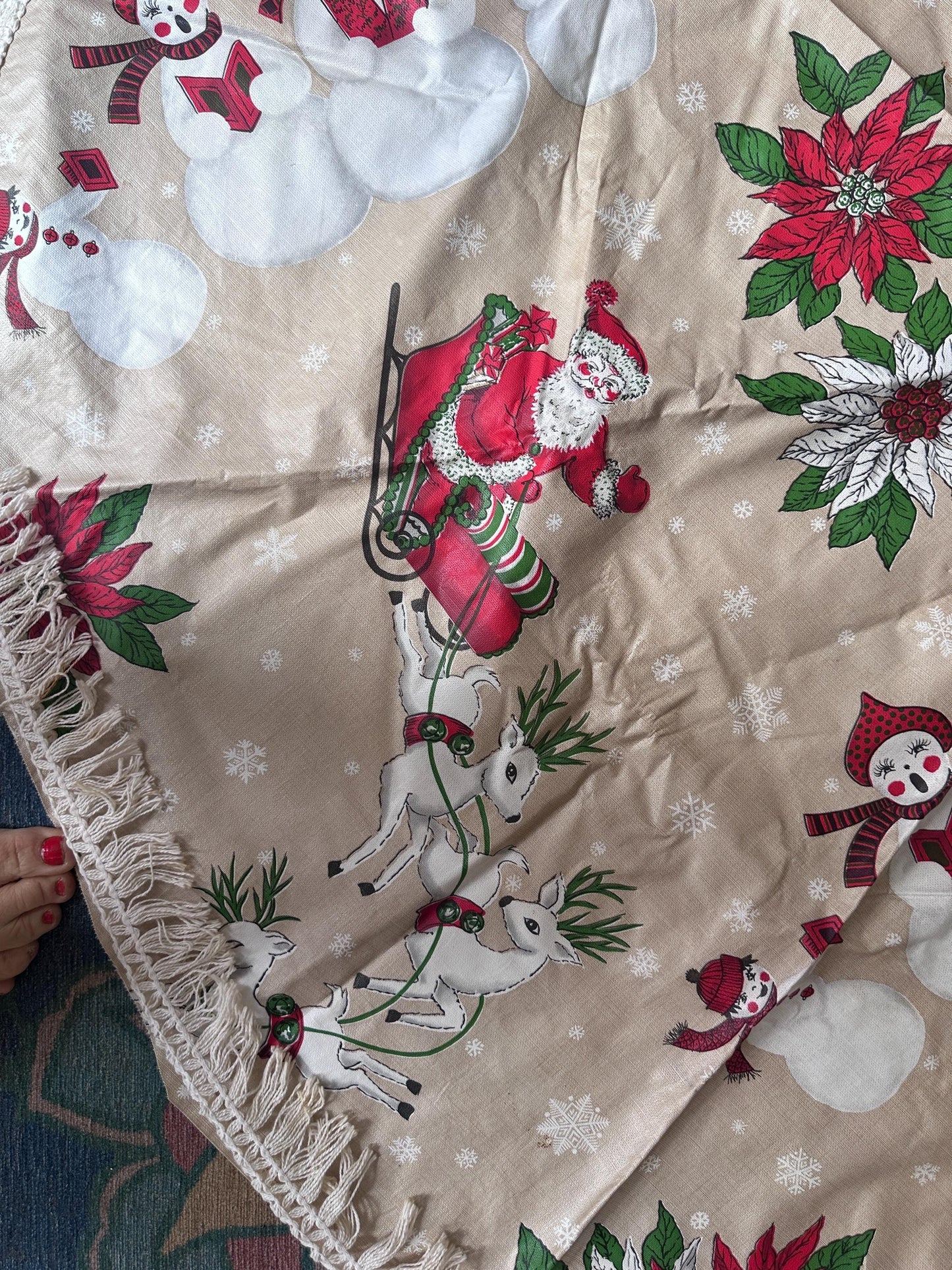Vintage Kitschy Christmas Round Vinyl Tablecloth | Santa, Snowy Winter & Poinsettia Holiday Print | 60” with White Trim | Retro Holiday Deco