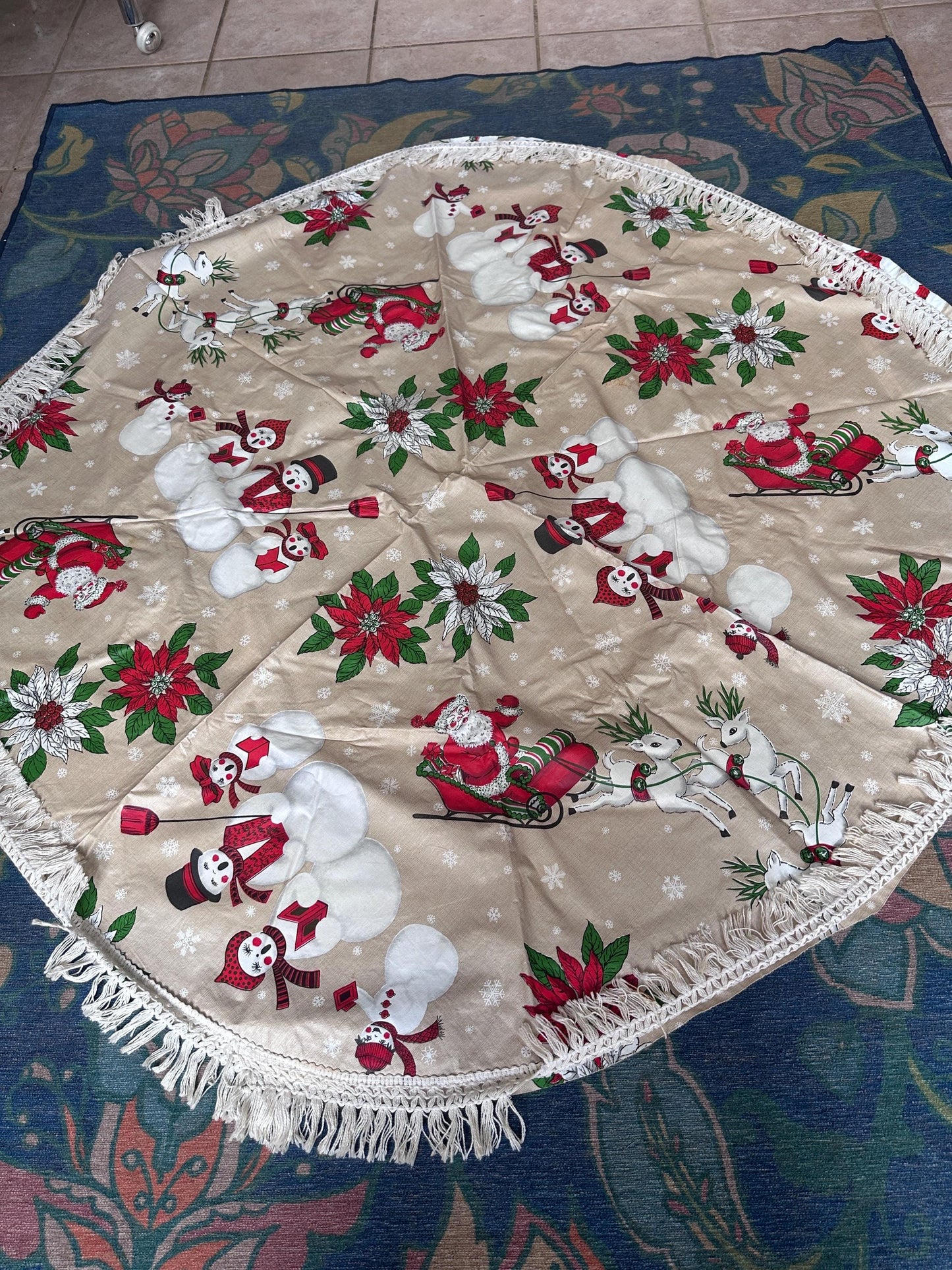 Vintage Kitschy Christmas Round Vinyl Tablecloth | Santa, Snowy Winter & Poinsettia Holiday Print | 60” with White Trim | Retro Holiday Deco